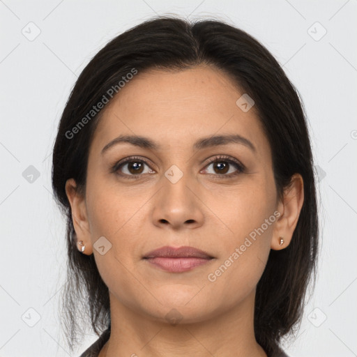 Joyful latino young-adult female with long  brown hair and brown eyes