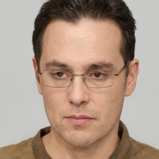 Neutral white adult male with short  brown hair and grey eyes