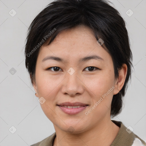 Joyful asian young-adult female with medium  brown hair and brown eyes