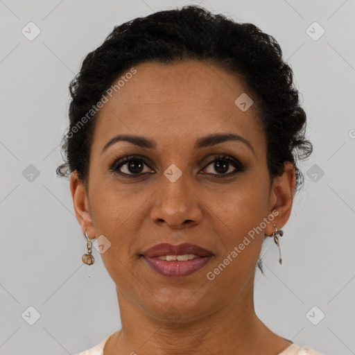 Joyful black adult female with short  brown hair and brown eyes