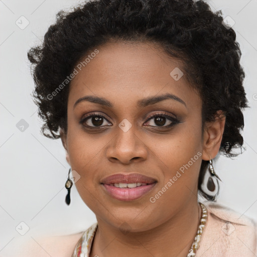 Joyful black young-adult female with long  brown hair and brown eyes