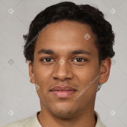 Joyful latino young-adult male with short  brown hair and brown eyes