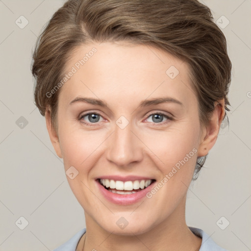 Joyful white young-adult female with short  brown hair and grey eyes