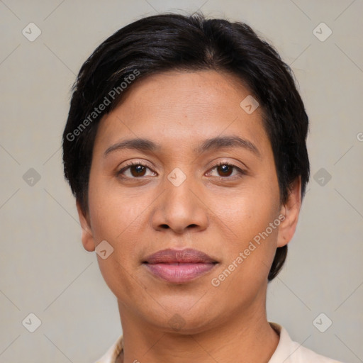 Joyful latino young-adult female with short  brown hair and brown eyes