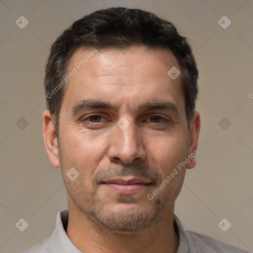 Joyful white adult male with short  brown hair and brown eyes