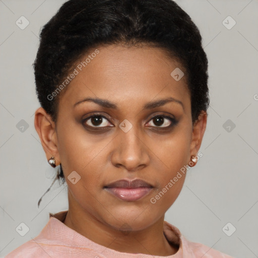 Joyful black young-adult female with short  brown hair and brown eyes