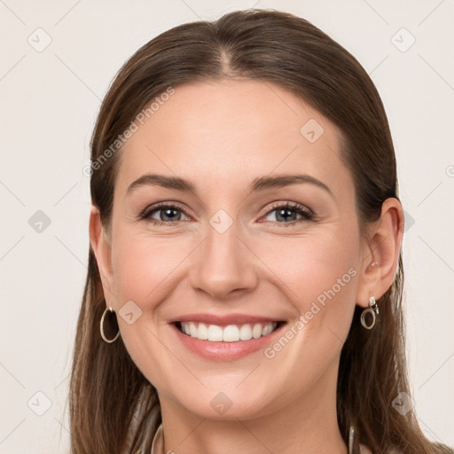 Joyful white young-adult female with long  brown hair and grey eyes