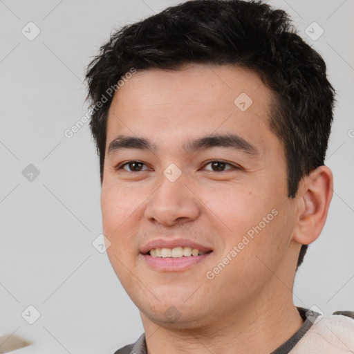 Joyful white young-adult male with short  black hair and brown eyes