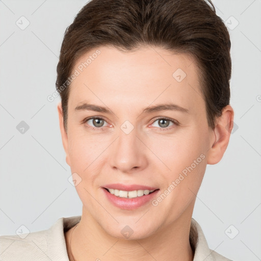 Joyful white young-adult female with short  brown hair and brown eyes