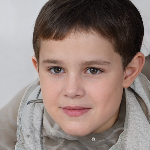 Joyful white child male with short  brown hair and brown eyes