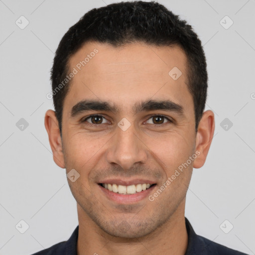 Joyful white young-adult male with short  black hair and brown eyes