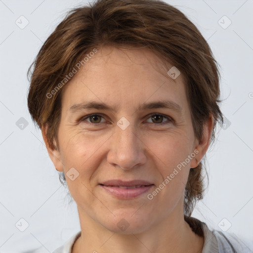 Joyful white adult female with medium  brown hair and brown eyes