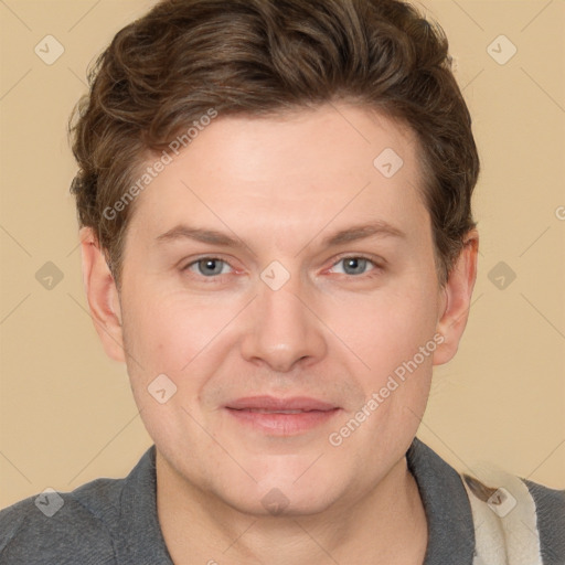 Joyful white adult male with short  brown hair and grey eyes