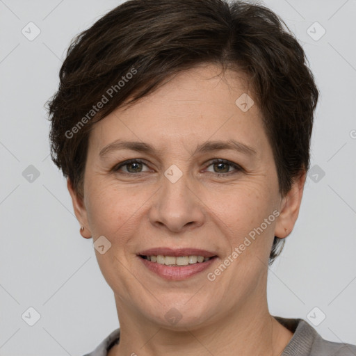 Joyful white adult female with short  brown hair and grey eyes