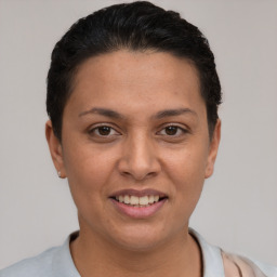 Joyful white young-adult female with short  brown hair and brown eyes