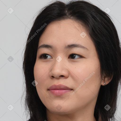 Joyful asian young-adult female with long  brown hair and brown eyes