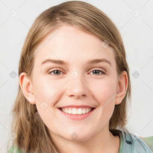 Joyful white young-adult female with medium  brown hair and blue eyes