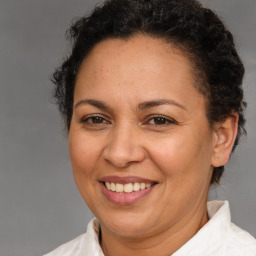 Joyful white adult female with short  brown hair and brown eyes