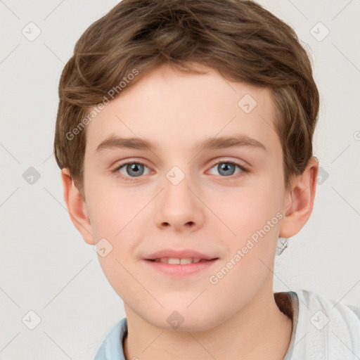 Joyful white child male with short  brown hair and grey eyes