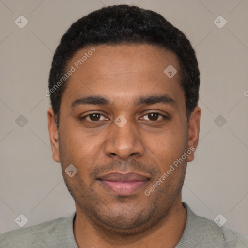 Joyful black young-adult male with short  black hair and brown eyes