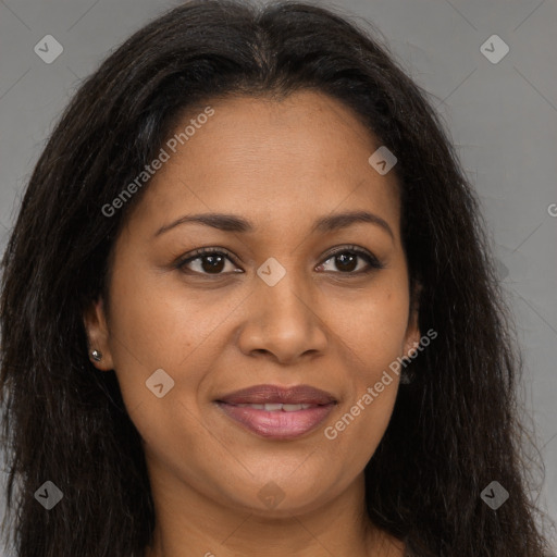 Joyful black young-adult female with long  brown hair and brown eyes