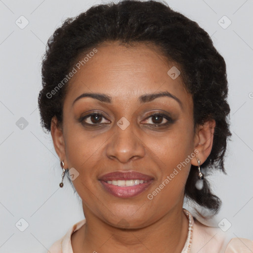 Joyful black adult female with short  brown hair and brown eyes