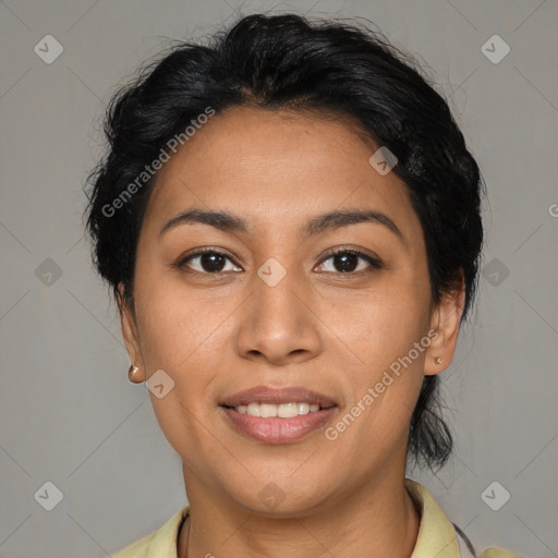 Joyful latino young-adult female with medium  brown hair and brown eyes