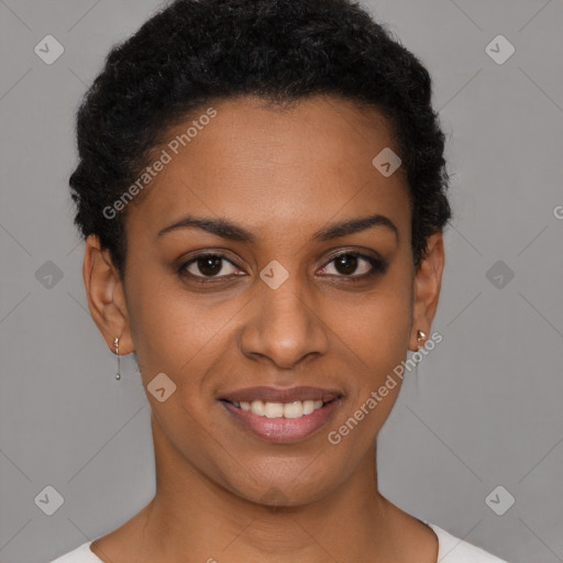 Joyful black young-adult female with short  brown hair and brown eyes