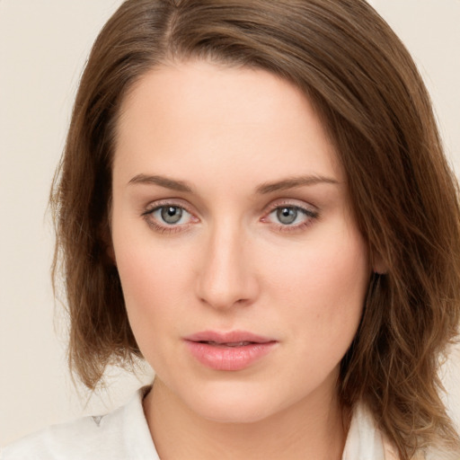 Neutral white young-adult female with medium  brown hair and green eyes