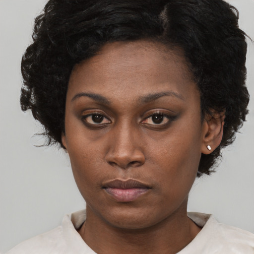 Neutral black young-adult female with short  black hair and brown eyes