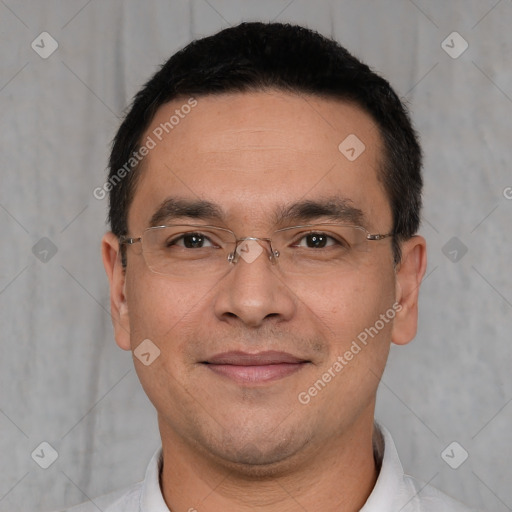 Joyful white adult male with short  black hair and brown eyes