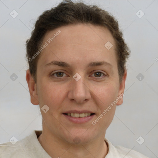 Joyful white adult female with short  brown hair and grey eyes