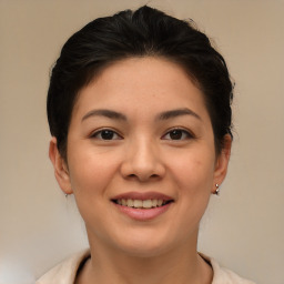 Joyful asian young-adult female with short  brown hair and brown eyes