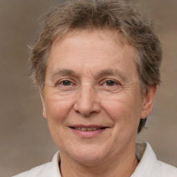 Joyful white middle-aged male with short  brown hair and brown eyes