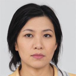 Neutral asian young-adult female with medium  black hair and brown eyes