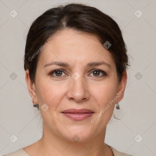 Joyful white adult female with medium  brown hair and grey eyes