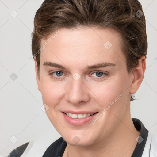 Joyful white young-adult female with short  brown hair and grey eyes