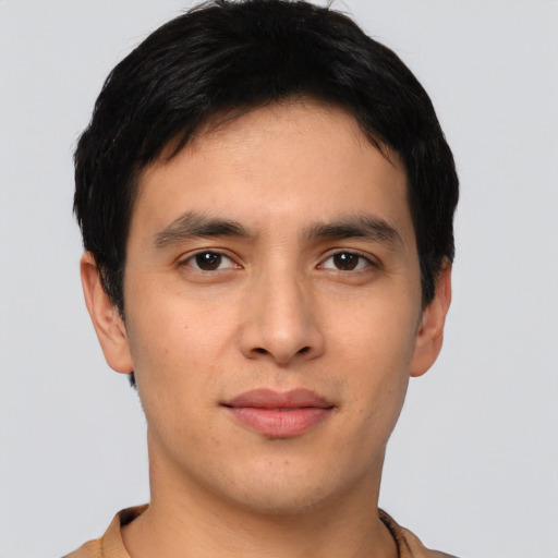 Joyful asian young-adult male with short  black hair and brown eyes