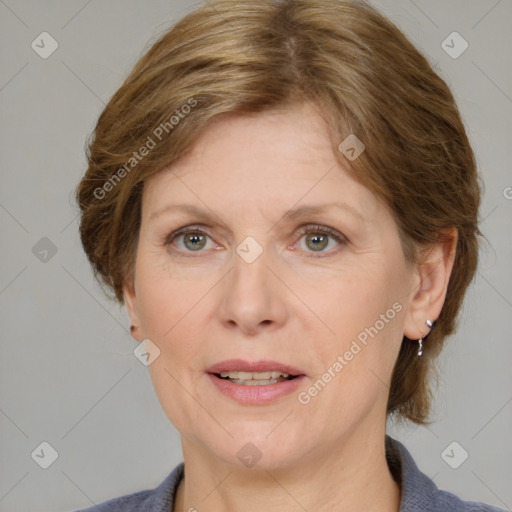 Joyful white adult female with medium  brown hair and blue eyes