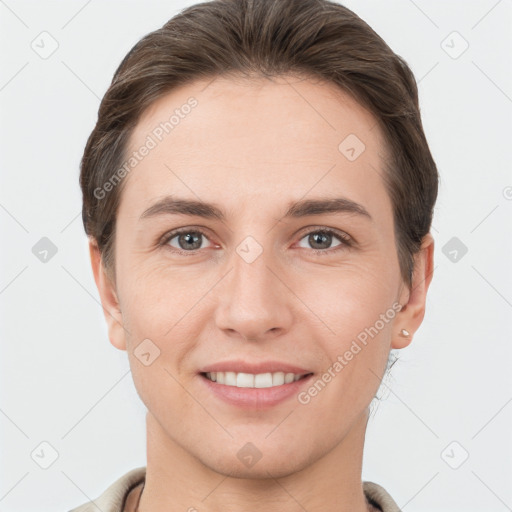 Joyful white young-adult female with short  brown hair and brown eyes