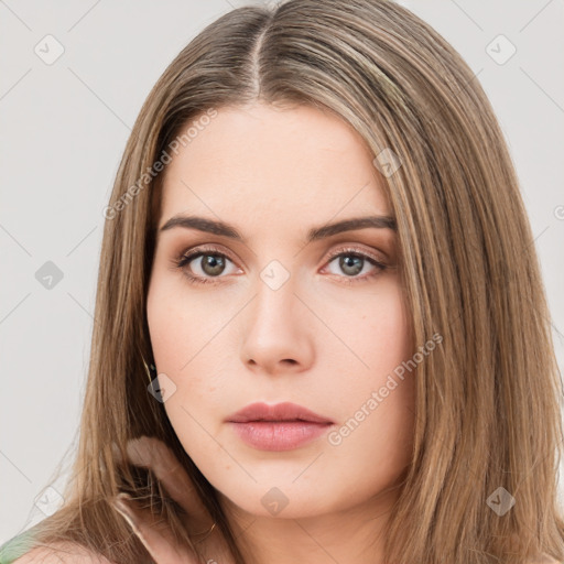 Neutral white young-adult female with long  brown hair and brown eyes