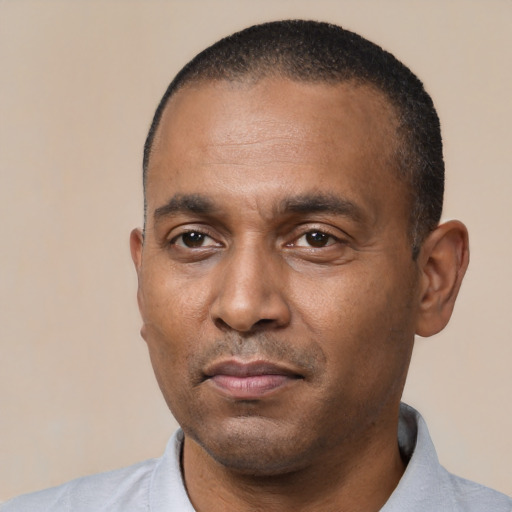 Neutral black adult male with short  black hair and brown eyes