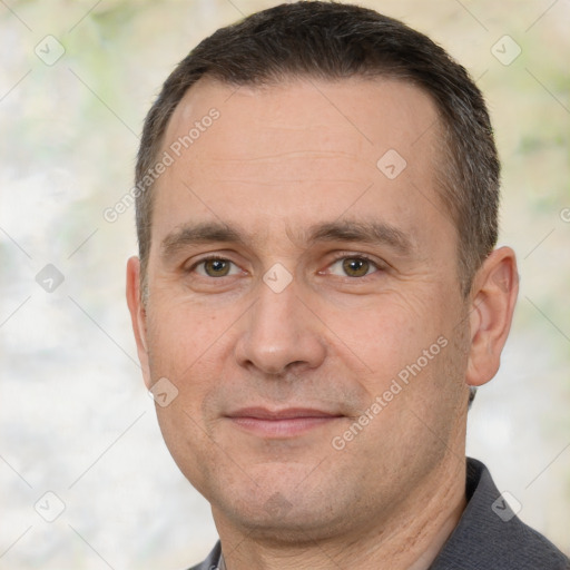 Joyful white adult male with short  brown hair and brown eyes