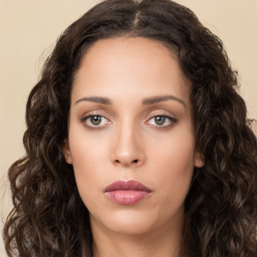 Neutral white young-adult female with long  brown hair and brown eyes