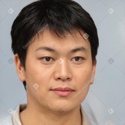 Joyful asian young-adult male with short  brown hair and brown eyes