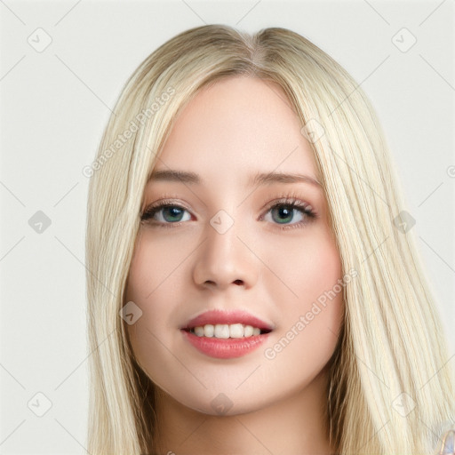 Joyful white young-adult female with long  brown hair and blue eyes