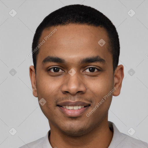 Joyful black young-adult male with short  black hair and brown eyes