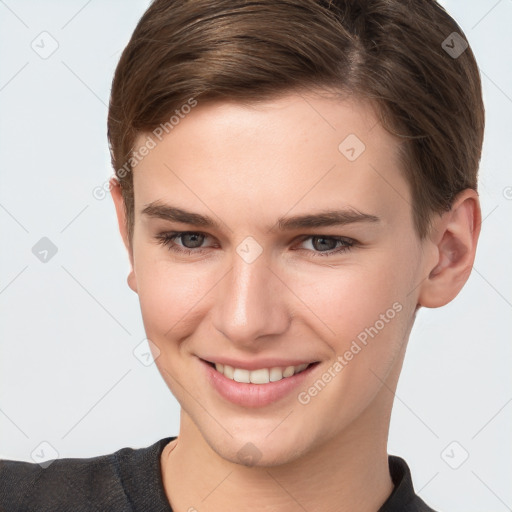 Joyful white young-adult female with short  brown hair and grey eyes