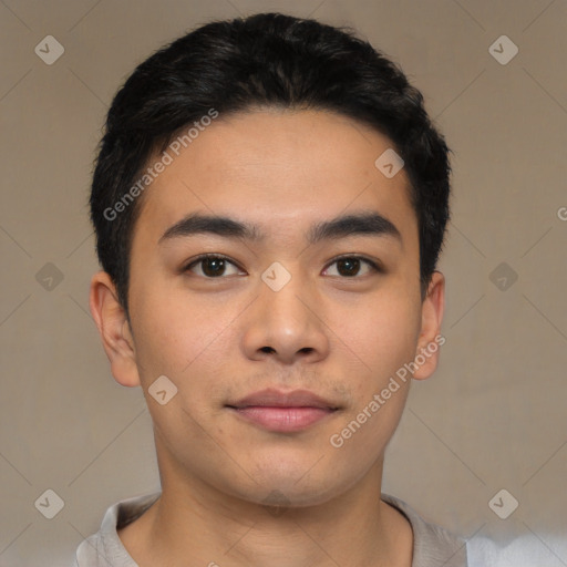 Joyful asian young-adult male with short  black hair and brown eyes