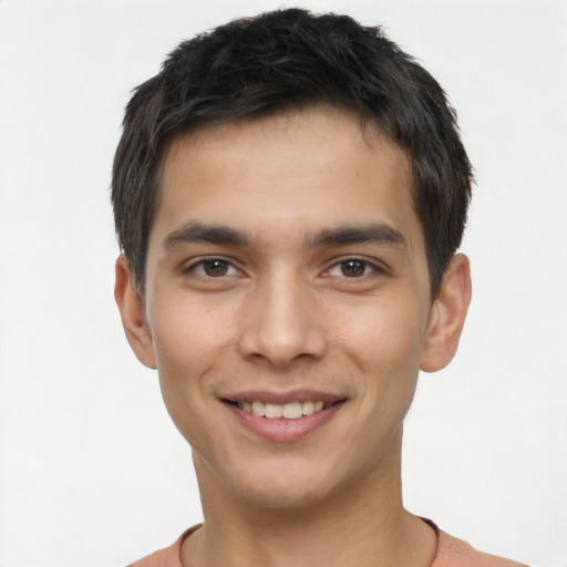 Joyful white young-adult male with short  black hair and brown eyes